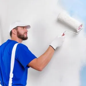 painter rolling a wall
